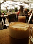 A view of the patio from a chai tea latte.